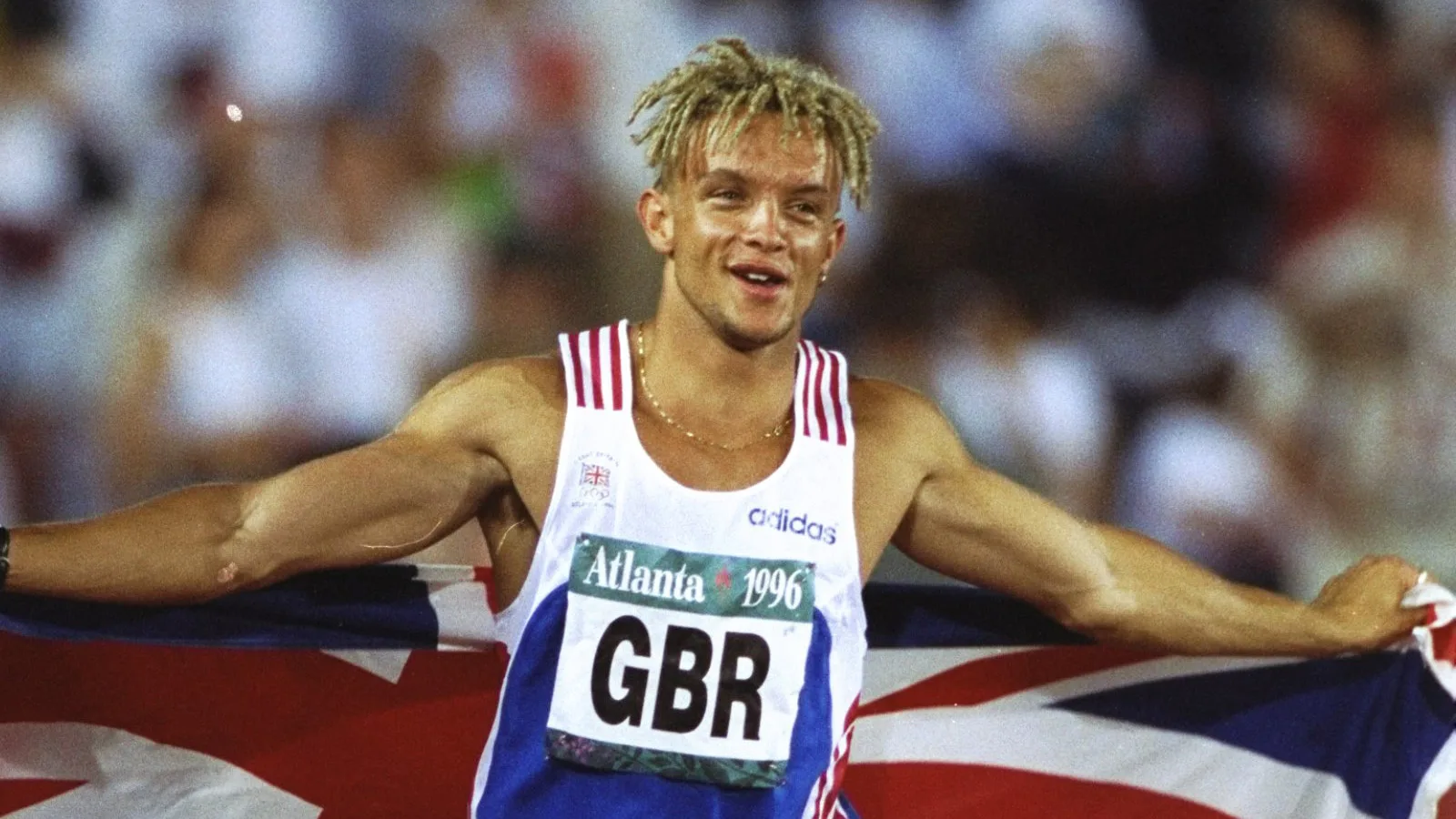 Jamie Baulch celebrating with the Union flag at the Atlanta 1996 Olympics