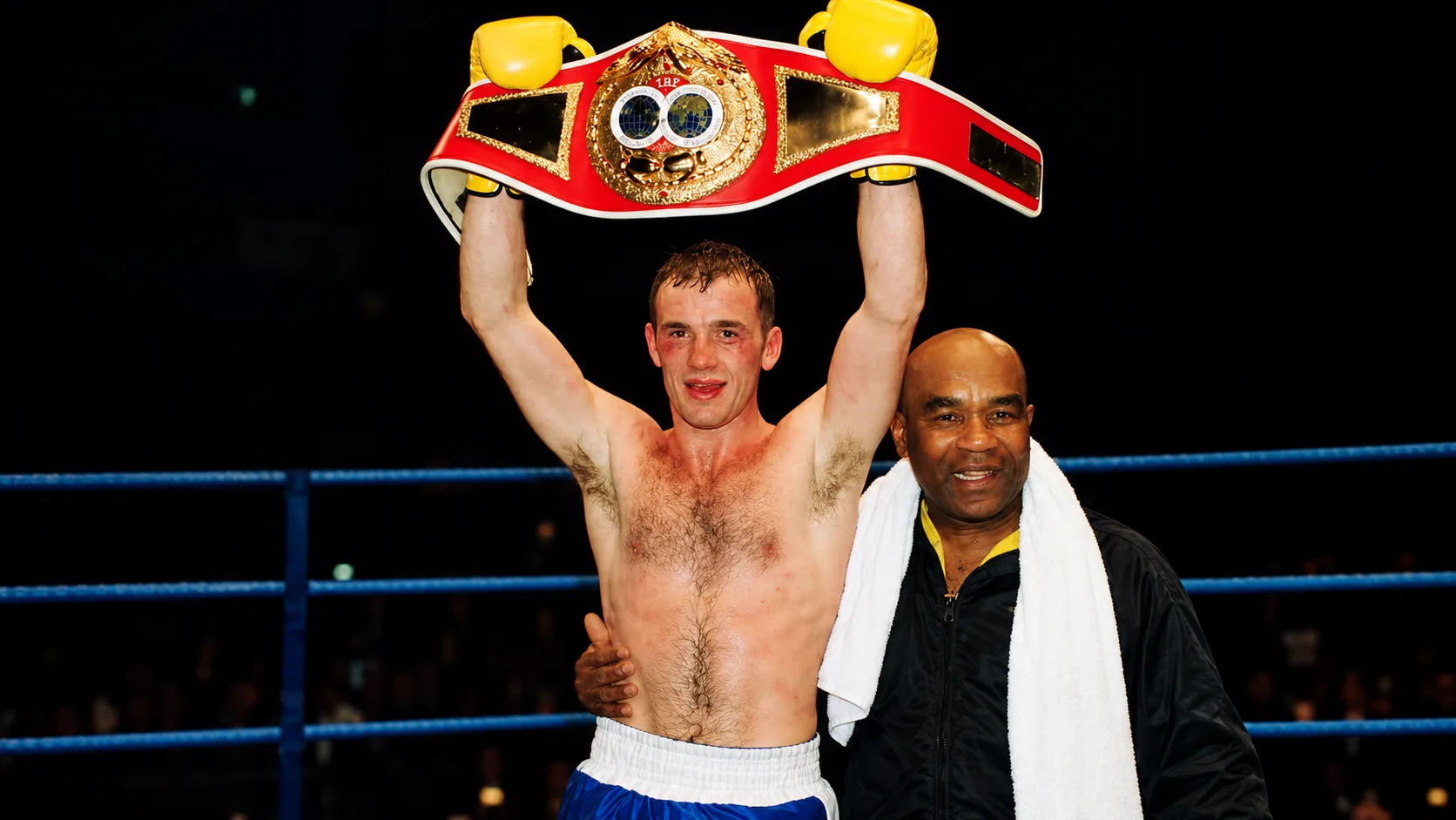 Barry Jones lifting the WBO super featherweight world title belt